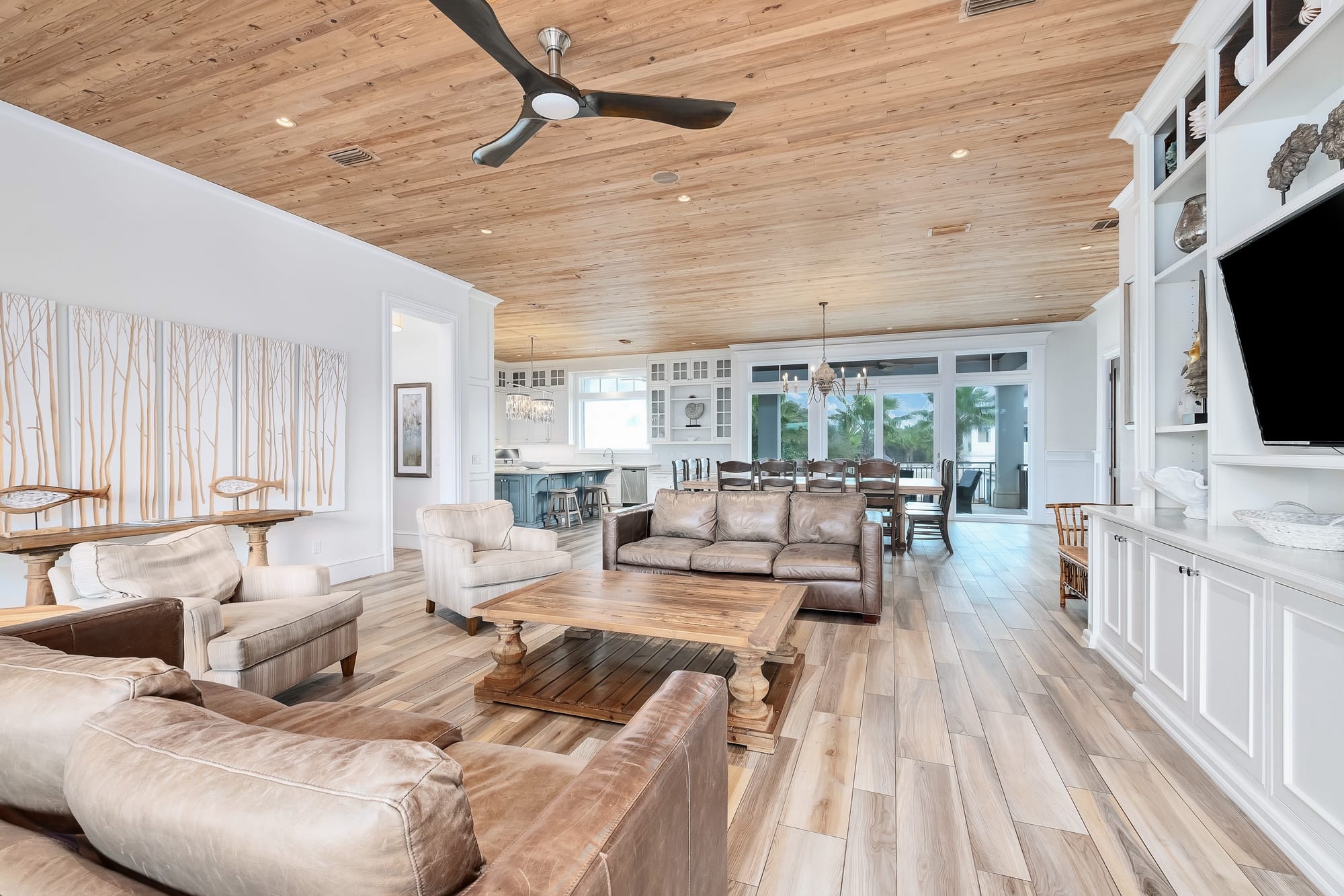 Spacious living room with wooden ceiling.