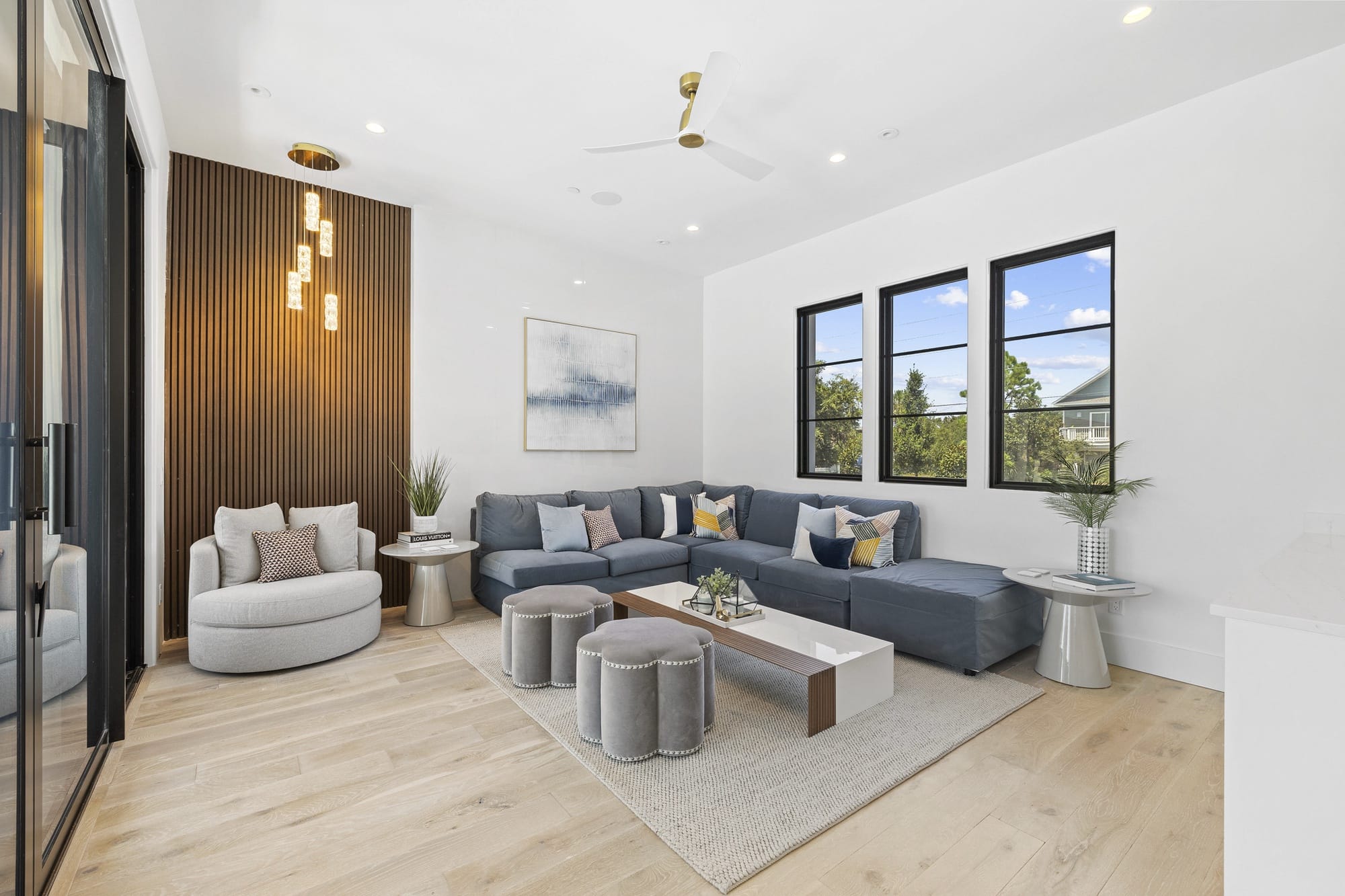 Modern living room with blue sofa.