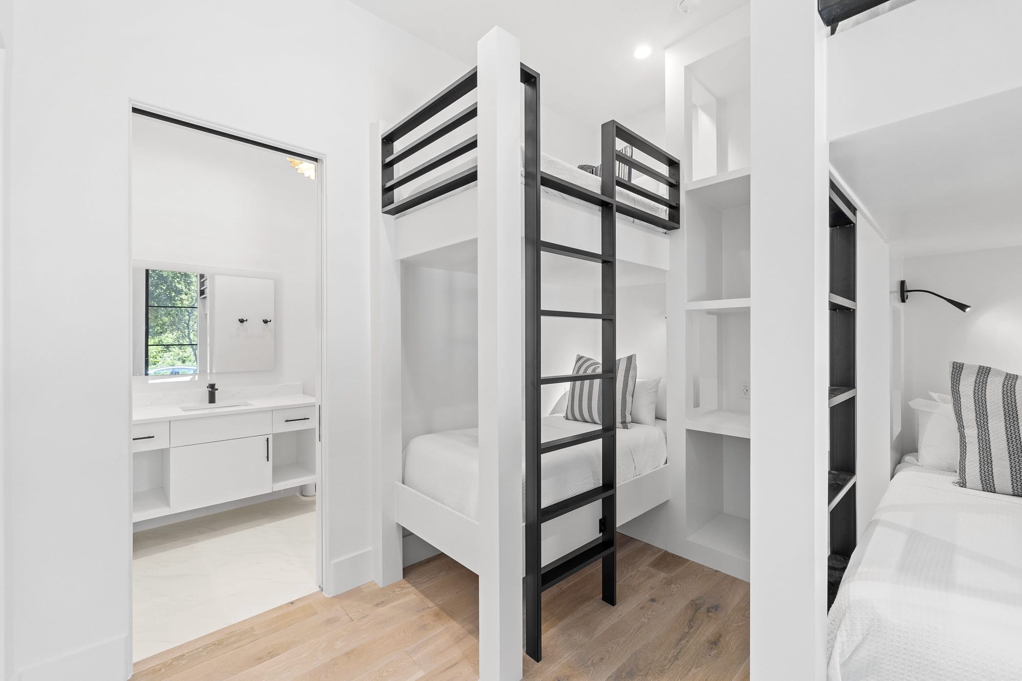 Modern bunk bed and bathroom.