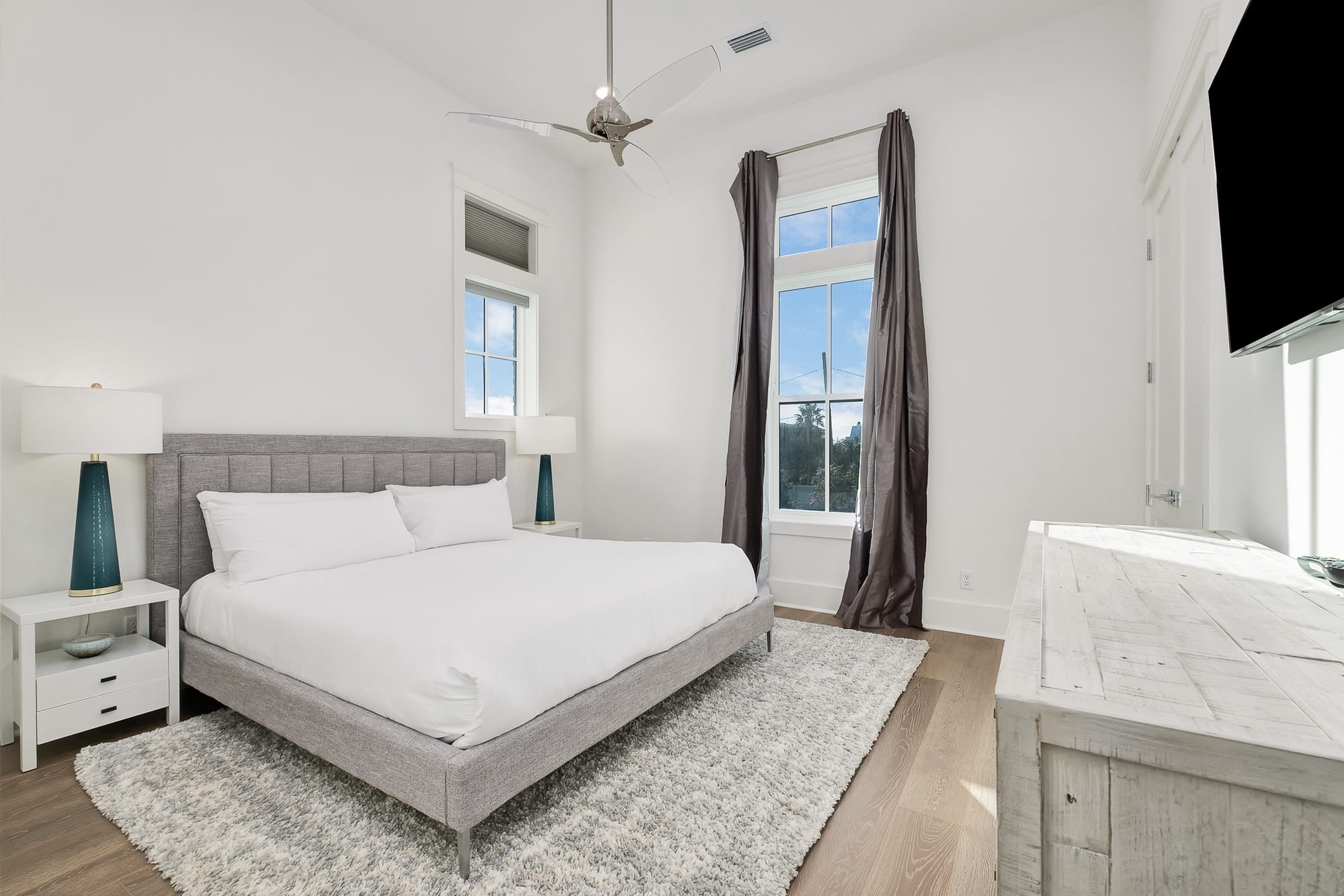 Minimalist bedroom with large window.