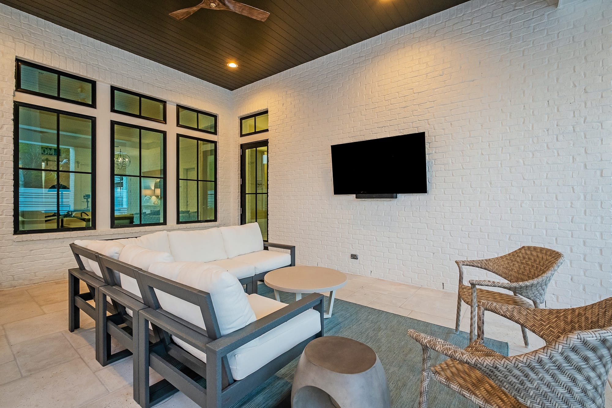 Patio with seating and TV.