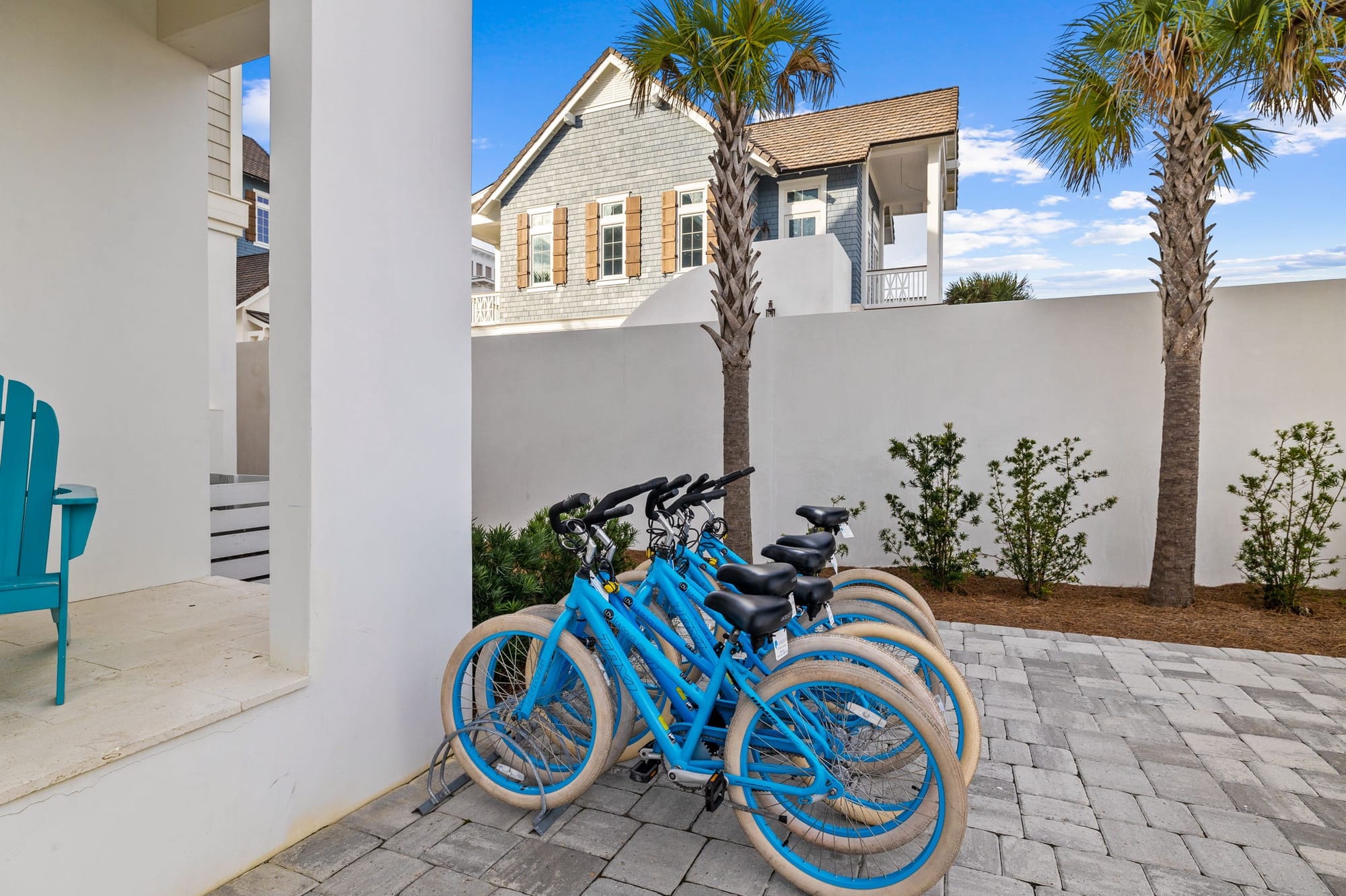 Blue bikes parked near house.