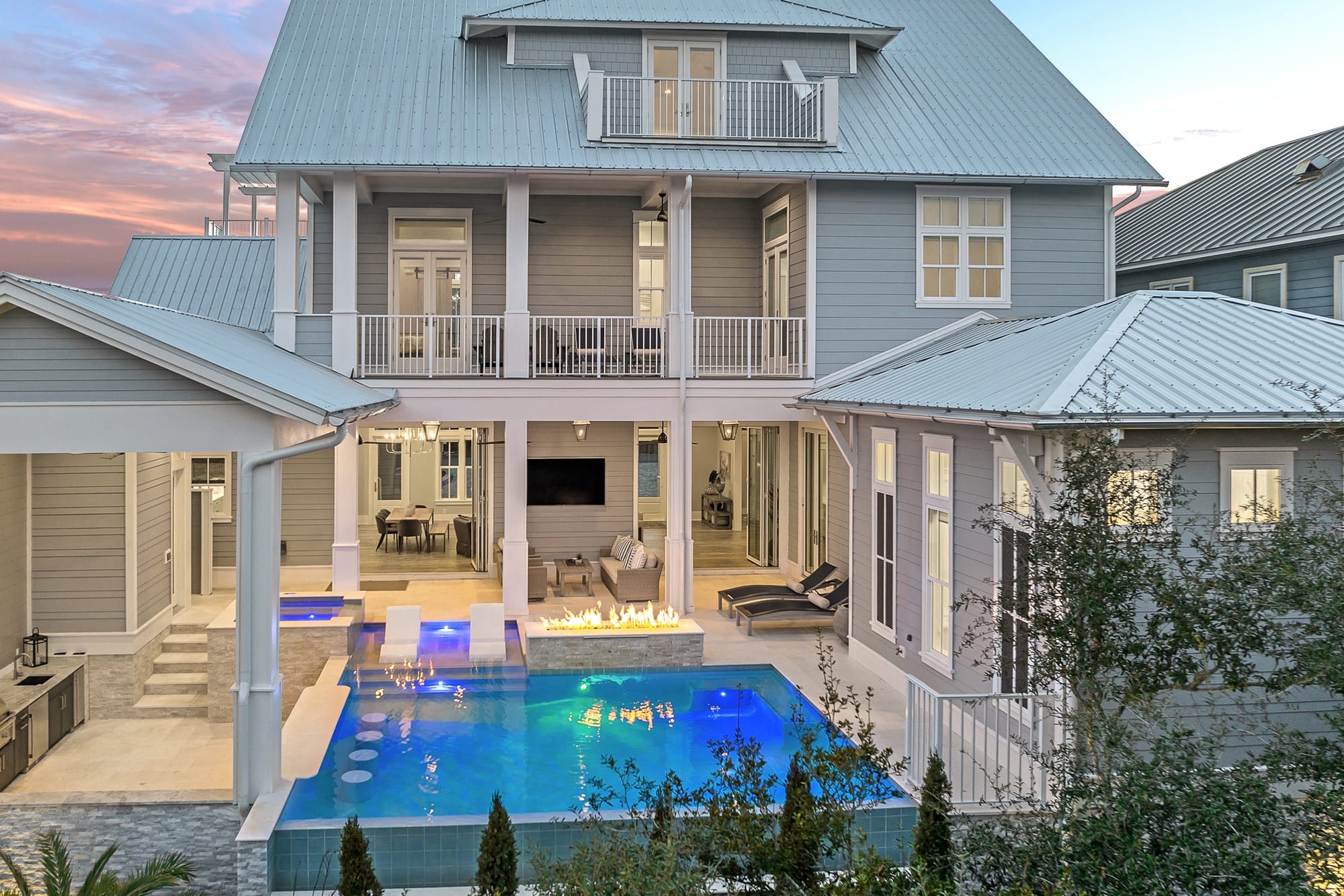 Modern house with pool and fire.