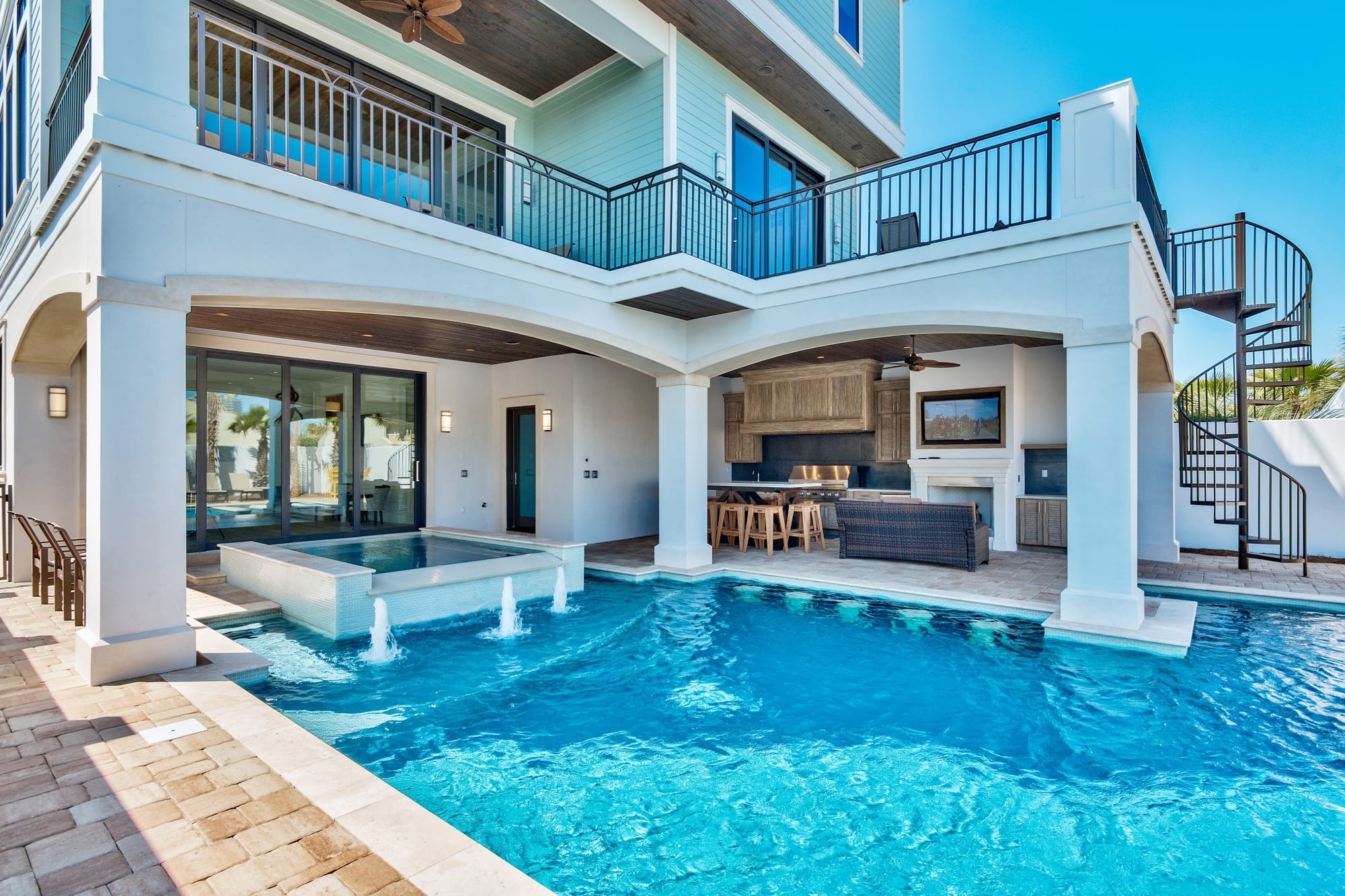 Luxury house with poolside patio.