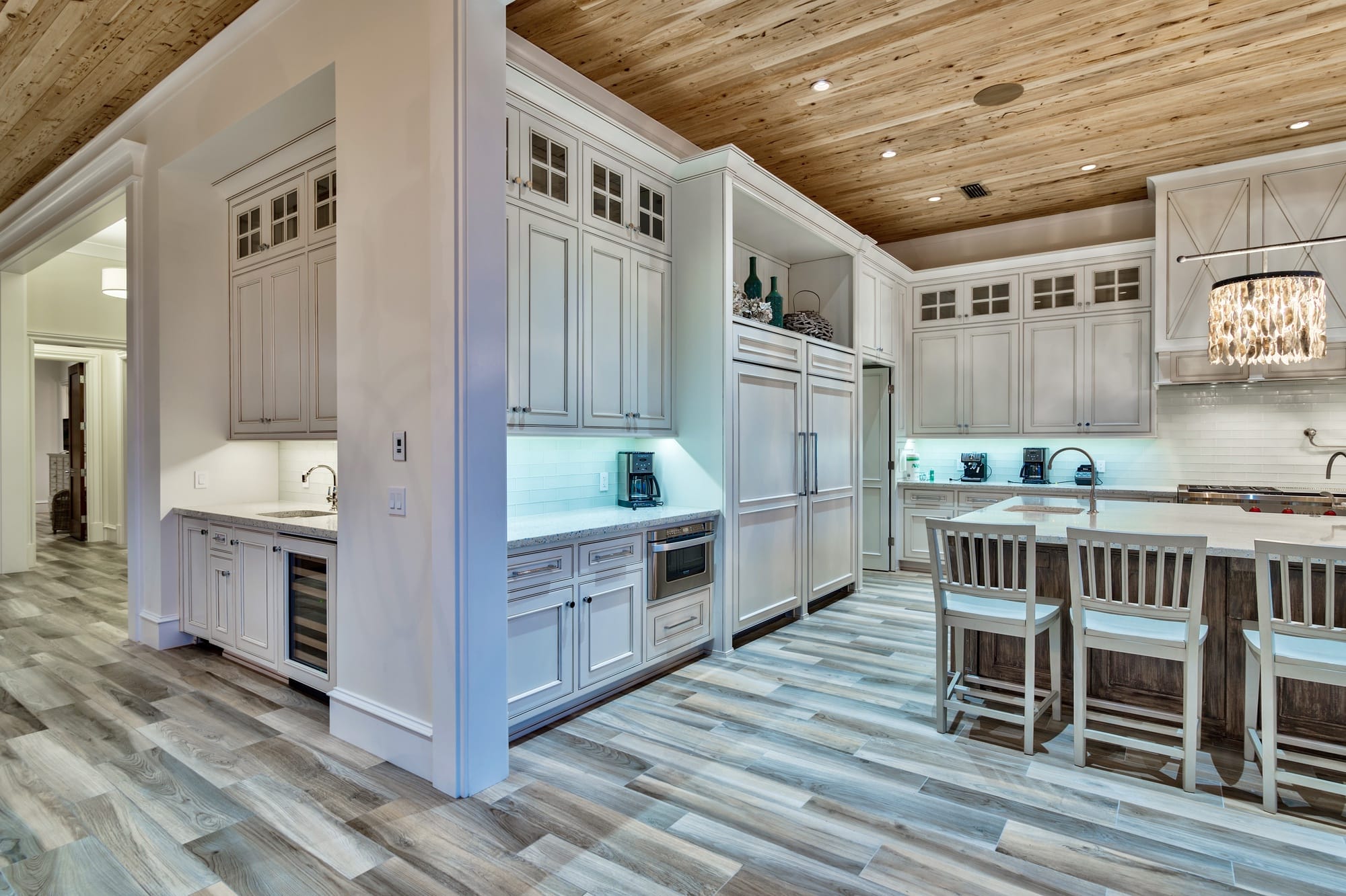 Modern kitchen with wooden flooring.