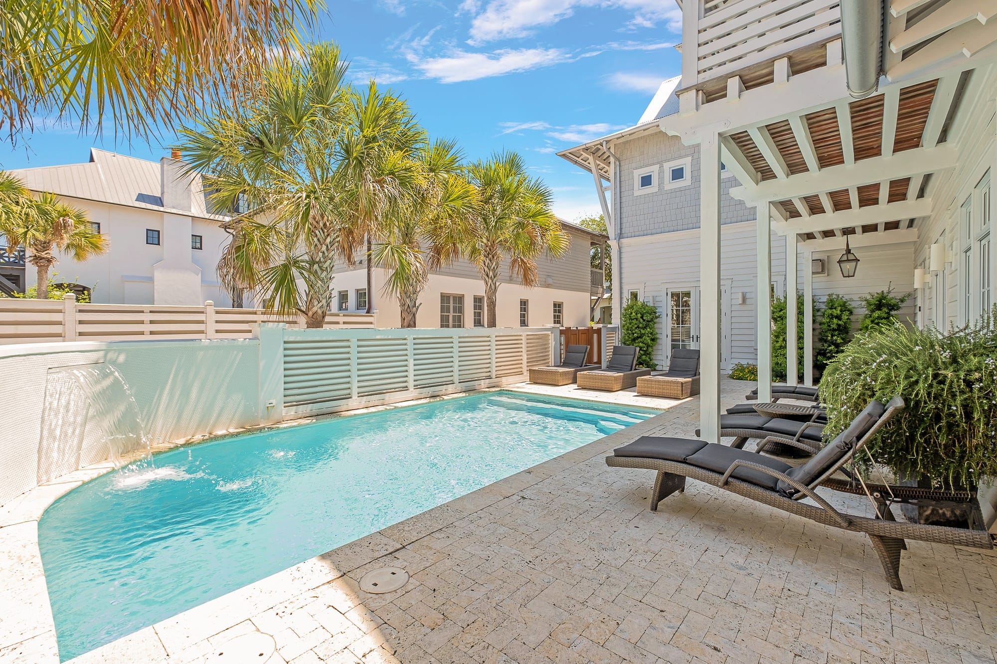 Poolside patio with lounge chairs.