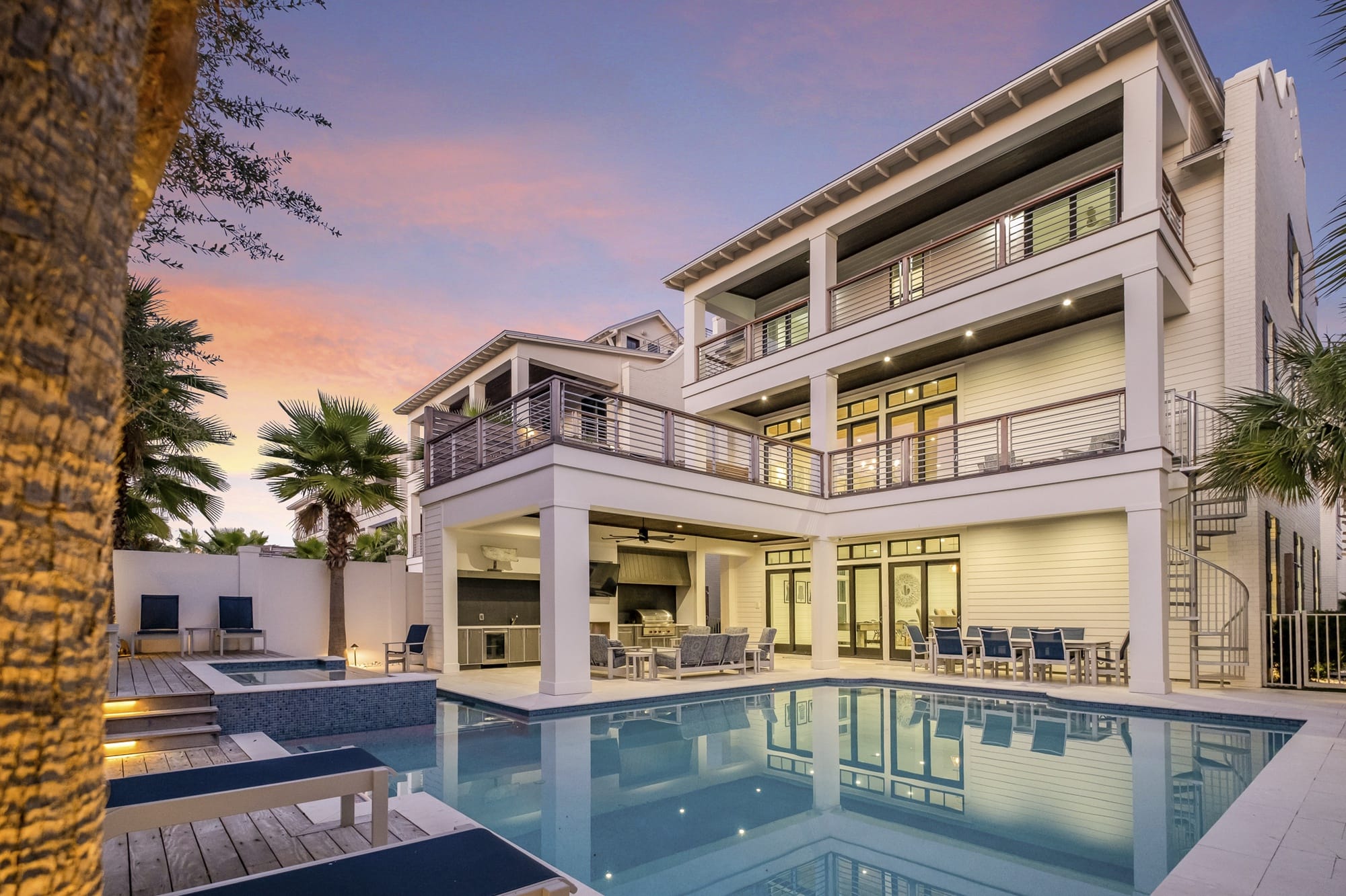 Luxury house with pool at sunset.