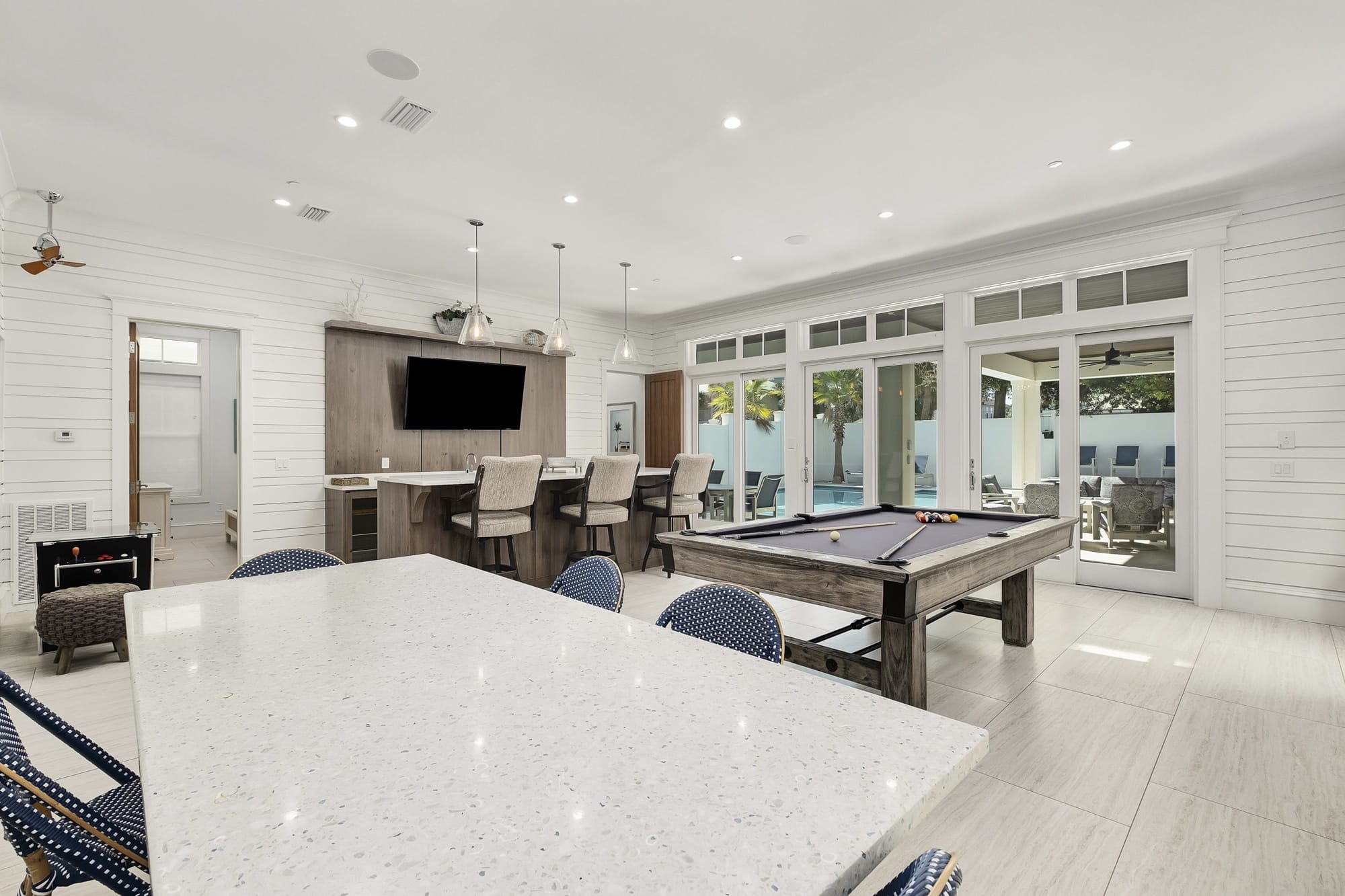 Modern game room with pool table.