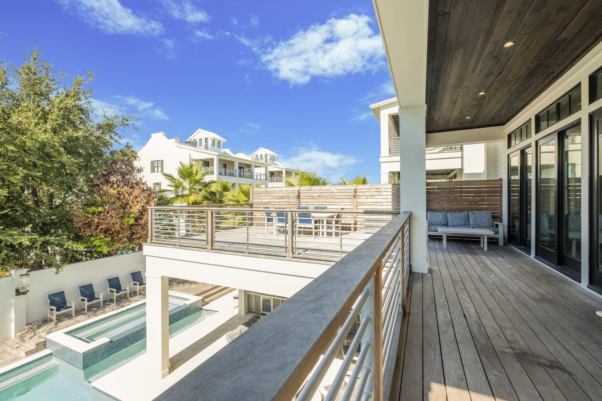 Modern terrace with pool view.