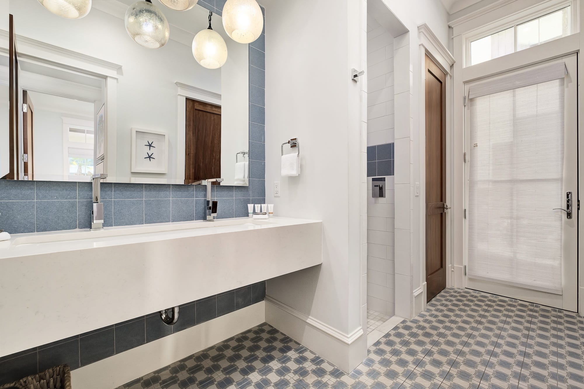 Modern bathroom with blue tiles.