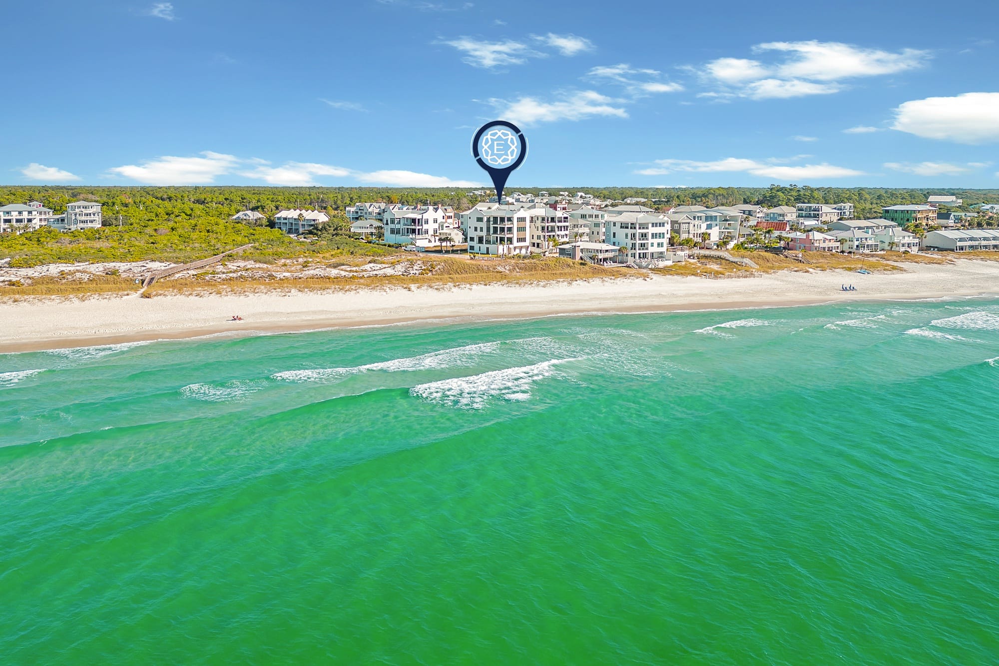 Aerial view of beachfront houses.