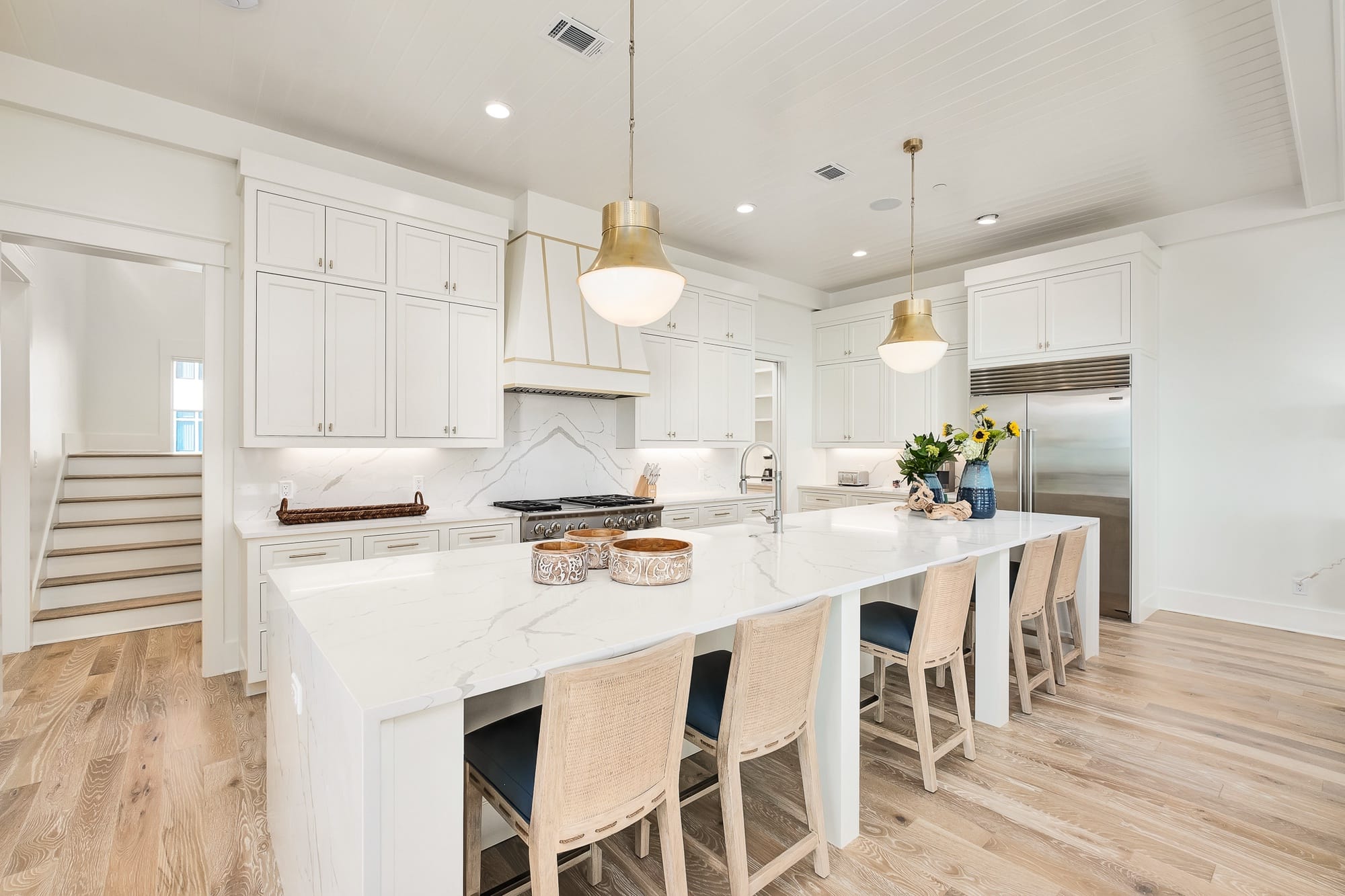 Modern kitchen with white island.