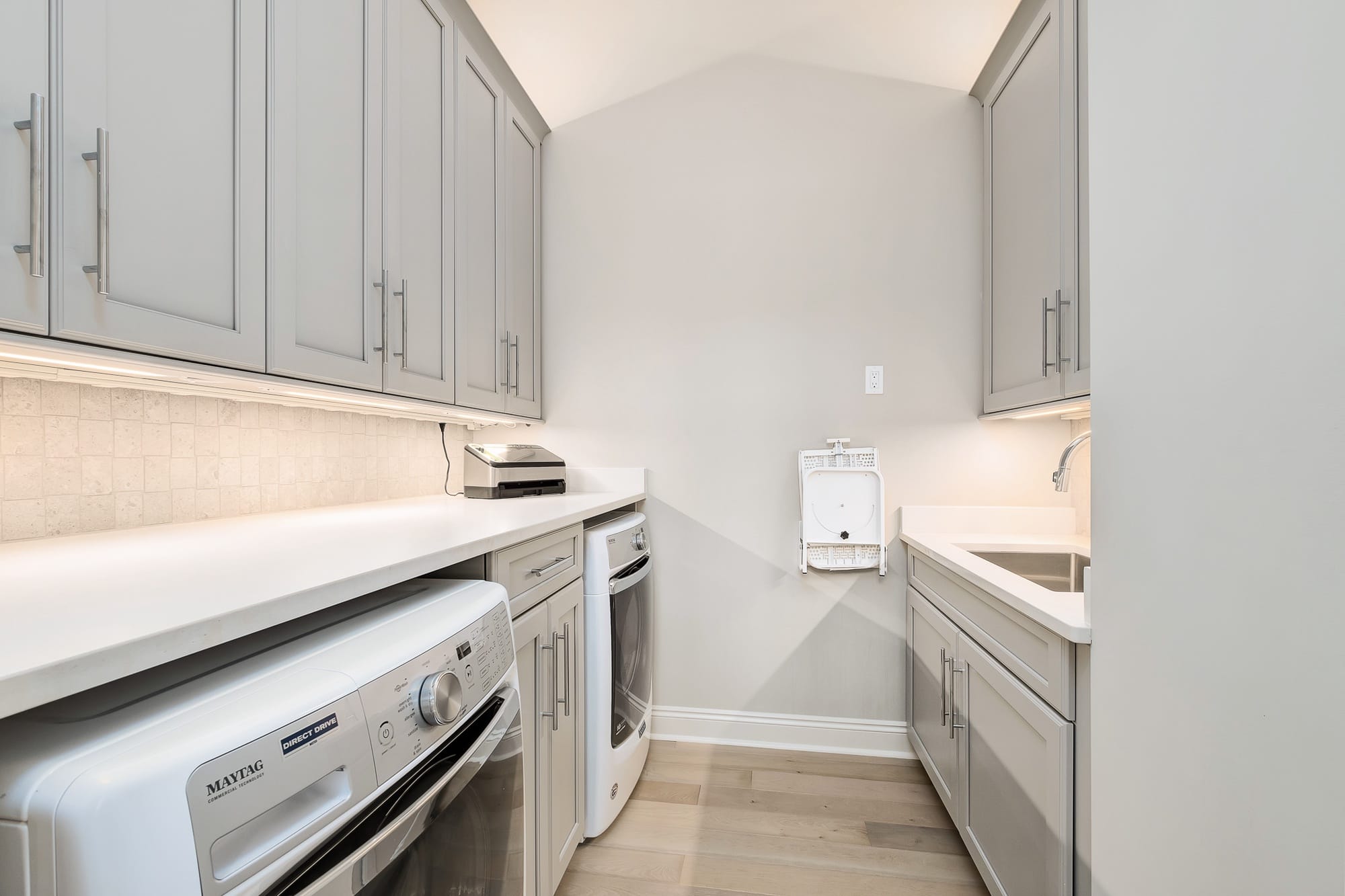 Modern laundry room with appliances.