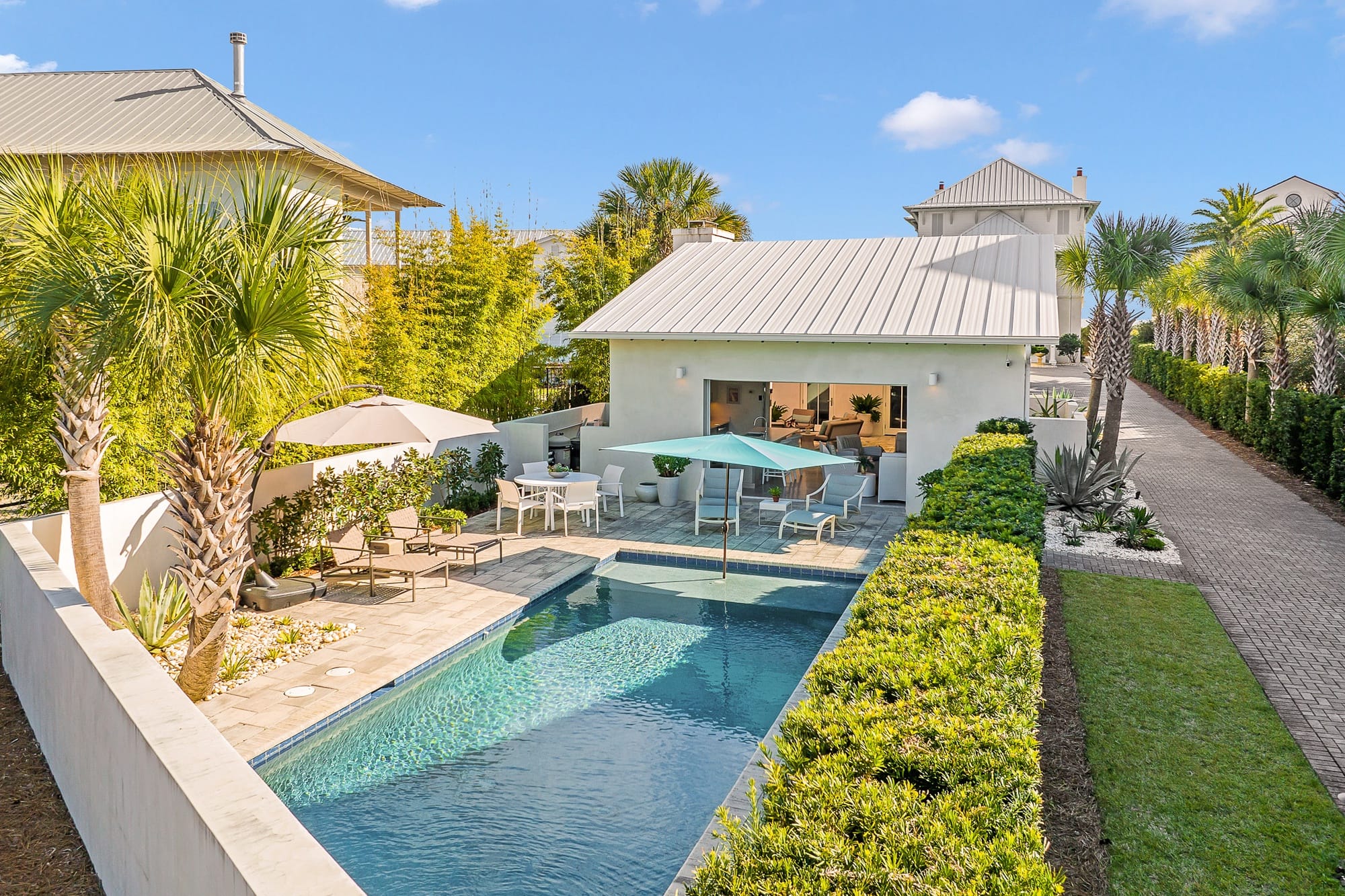 Backyard pool with modern patio.