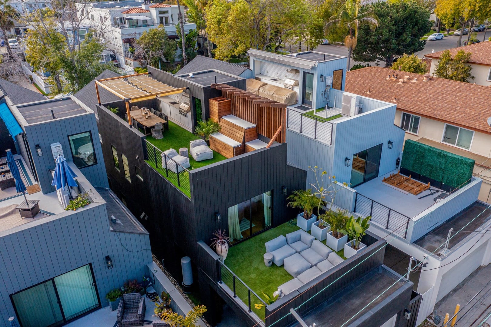 Modern rooftop terrace with seating.