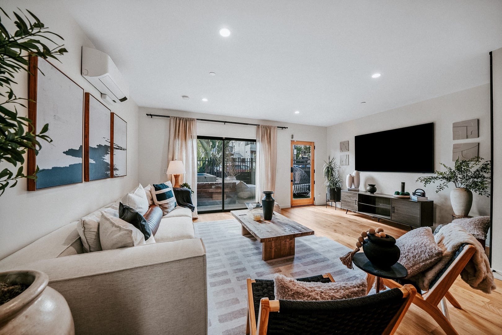 Modern living room with large windows.