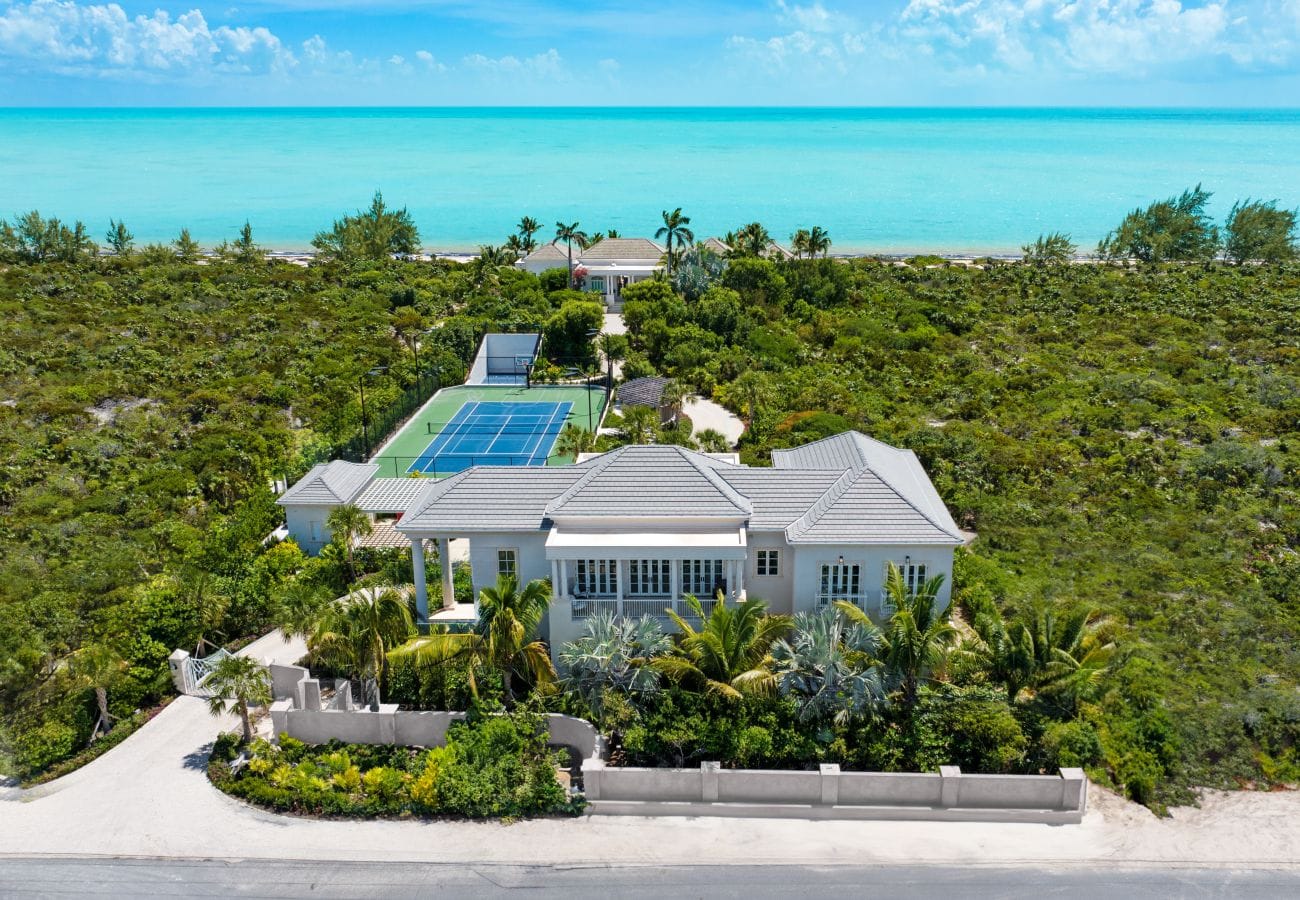 Coastal house with tennis court.