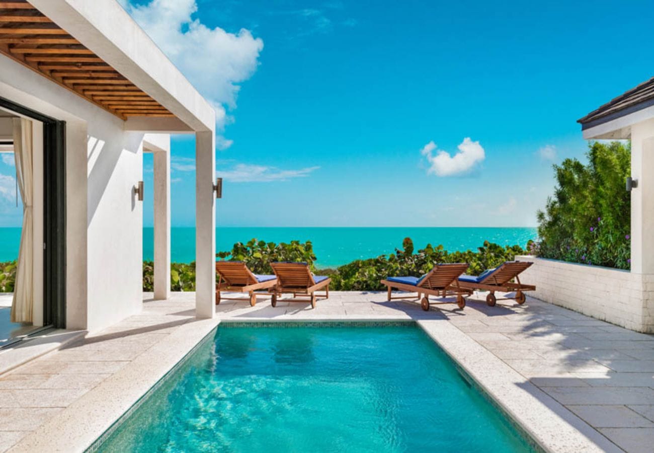 Poolside terrace overlooking the ocean.