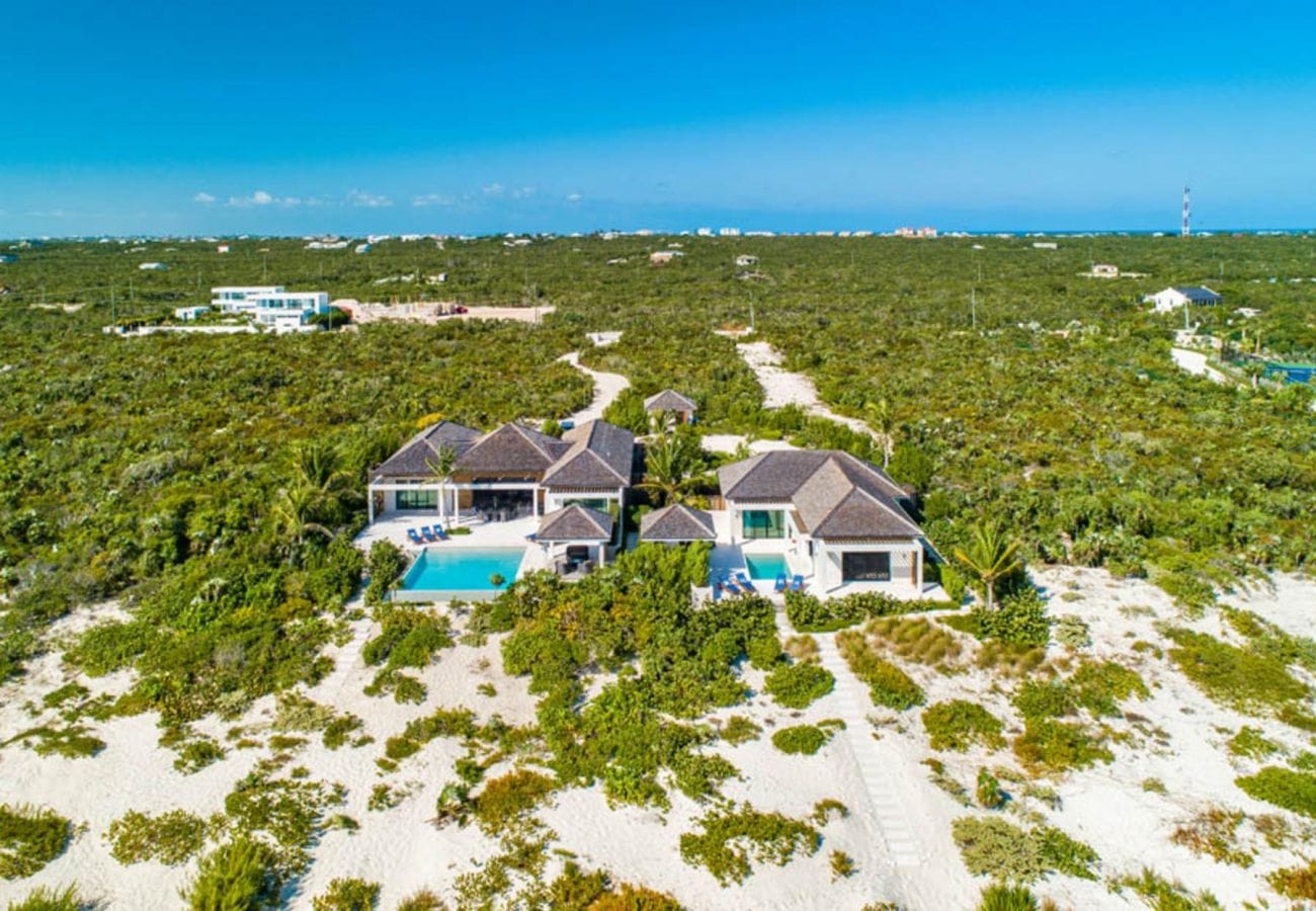 Coastal house with surrounding greenery.