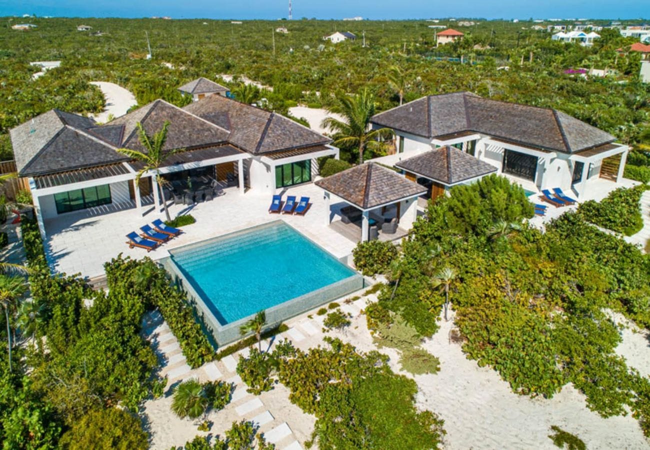 Luxury villa with pool, greenery.