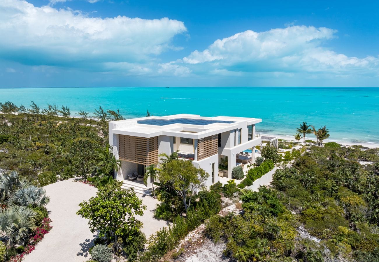 Modern beachside villa and ocean.