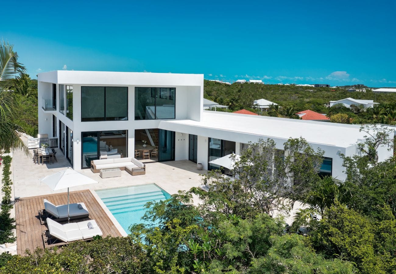 Modern house with pool, greenery.