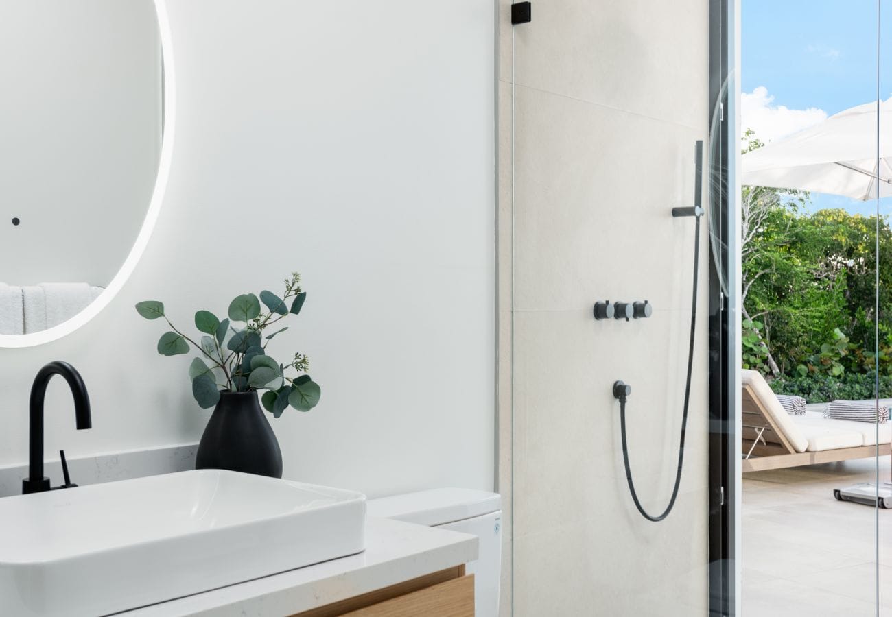 Modern bathroom with outdoor view.