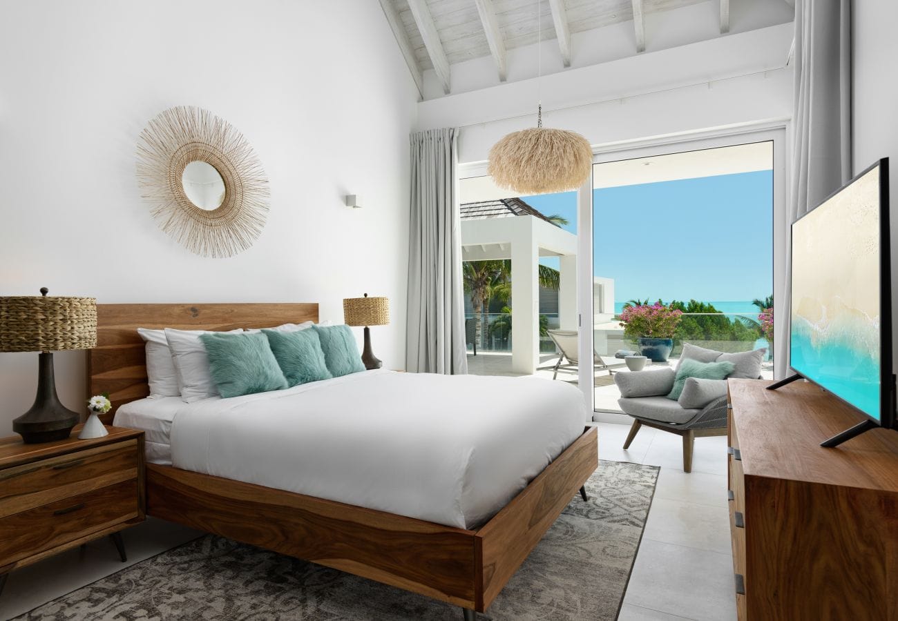 Bright bedroom with ocean view.