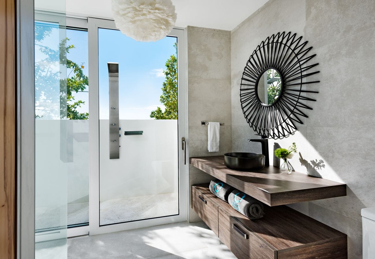 Modern bathroom with outdoor view.