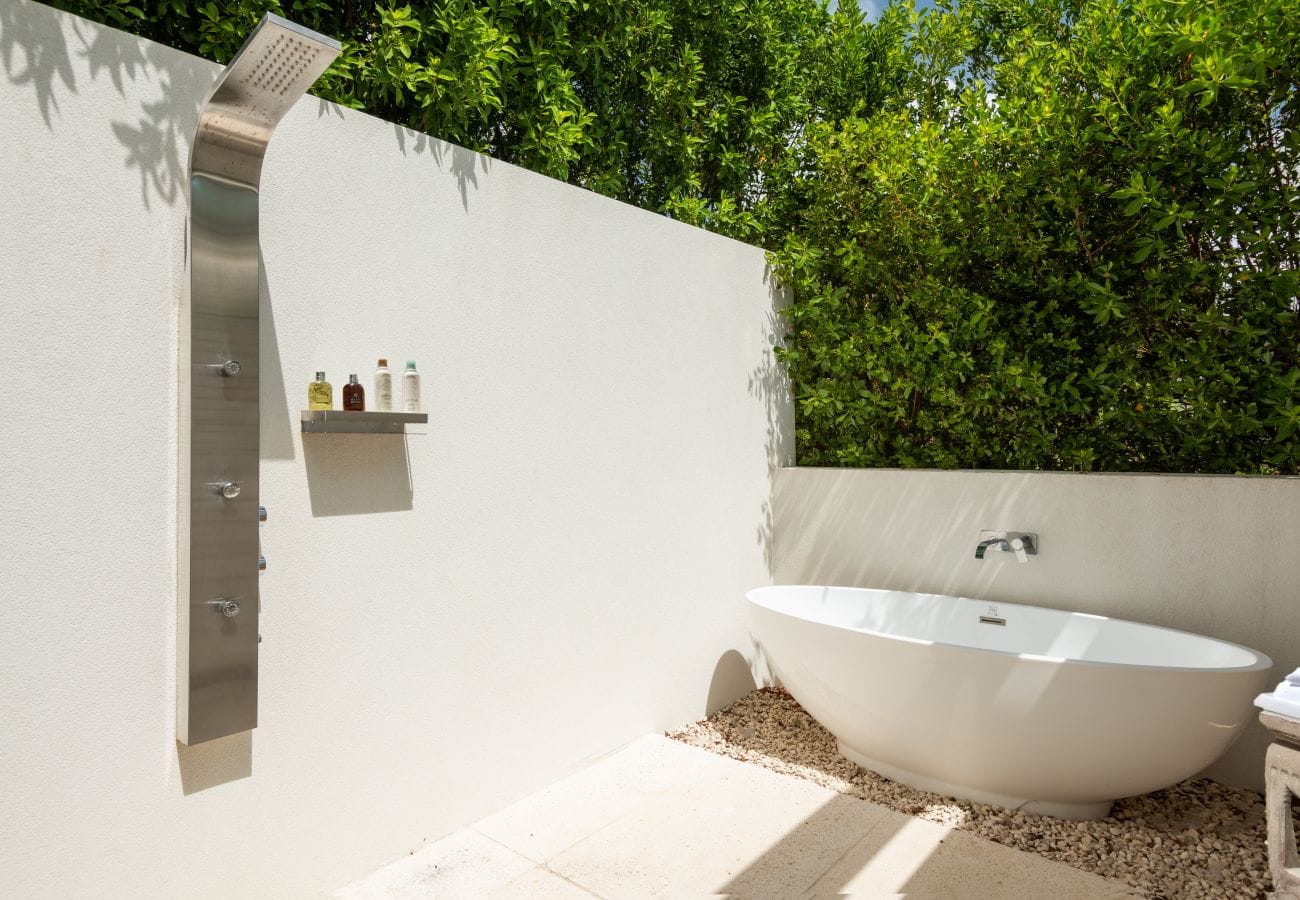 Outdoor bathtub and shower area.