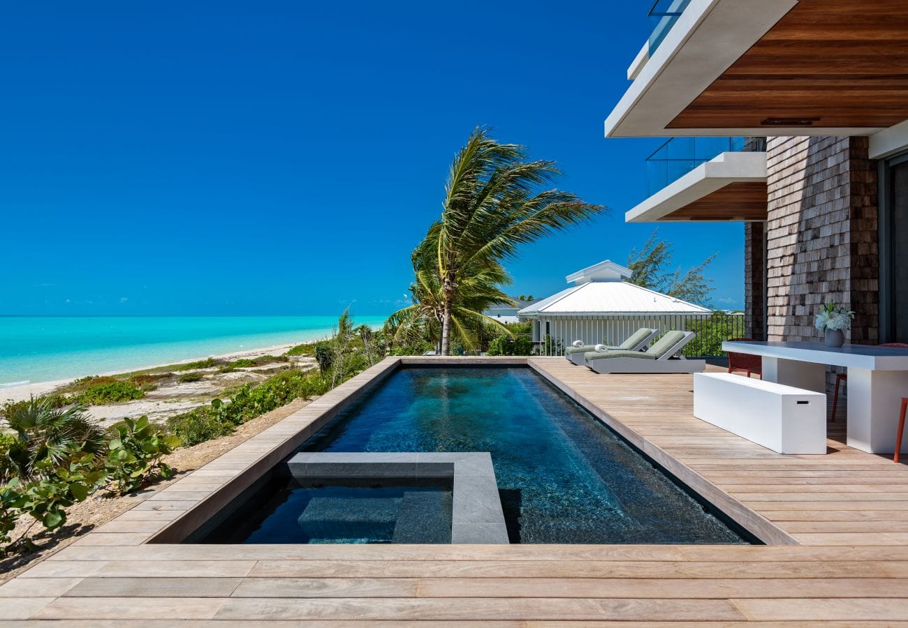 Beachfront pool and patio view.