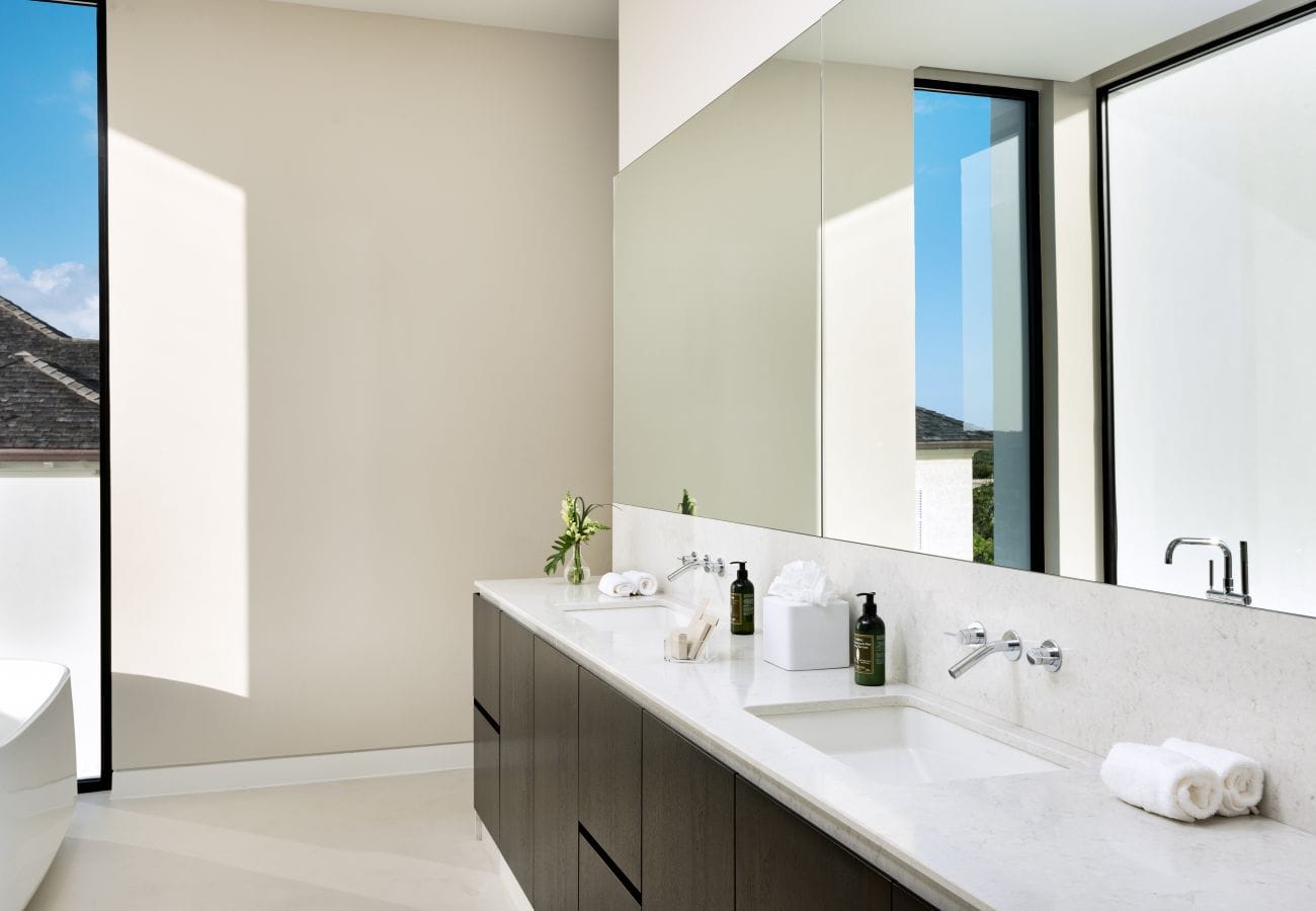 Modern bathroom with large mirror.