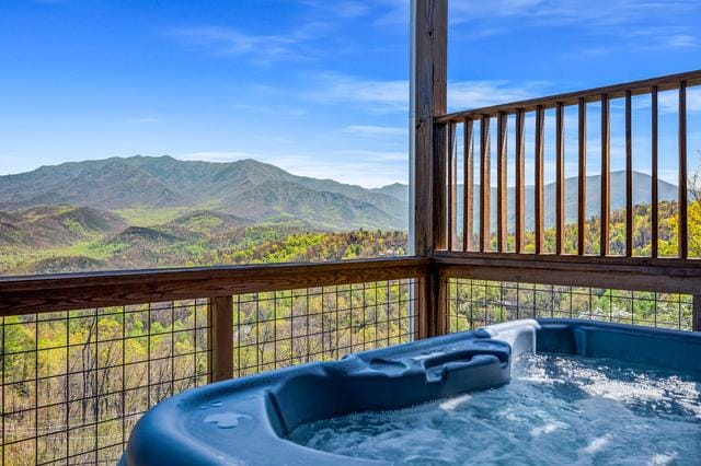 Hot tub overlooking scenic mountains.