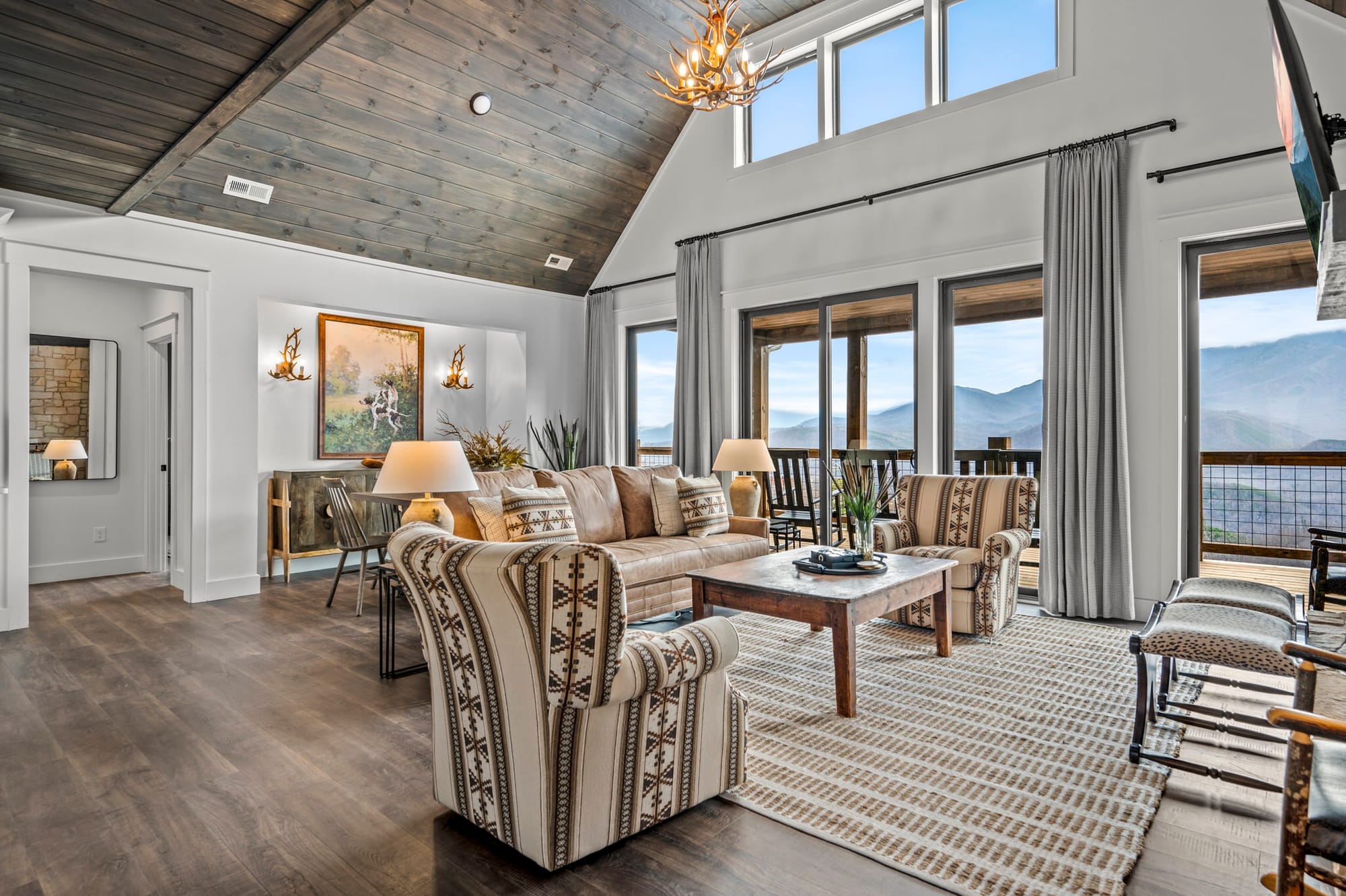 Rustic living room with mountain view.