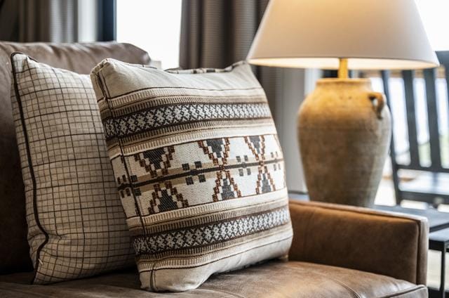 Decorative pillows on couch, lamp.