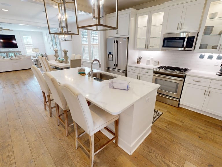 Modern kitchen with white cabinetry.