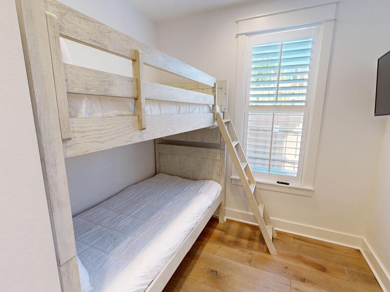 Bunk bed in small bedroom.