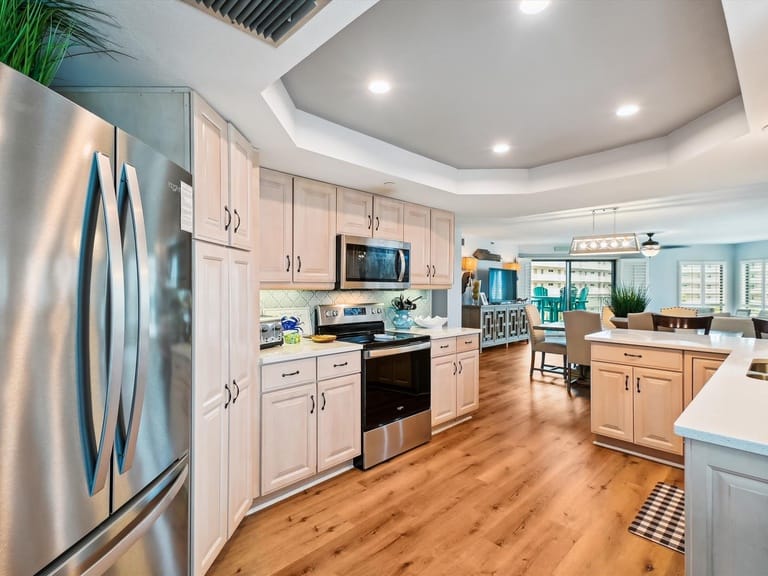 Modern kitchen with wooden flooring.