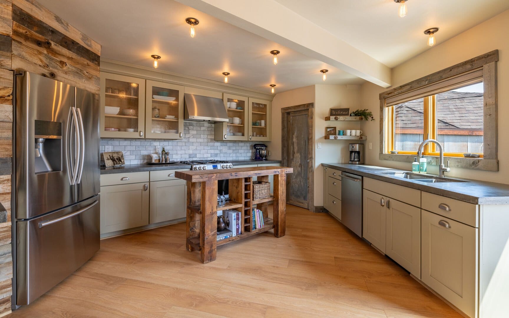 Rustic kitchen with wooden island.