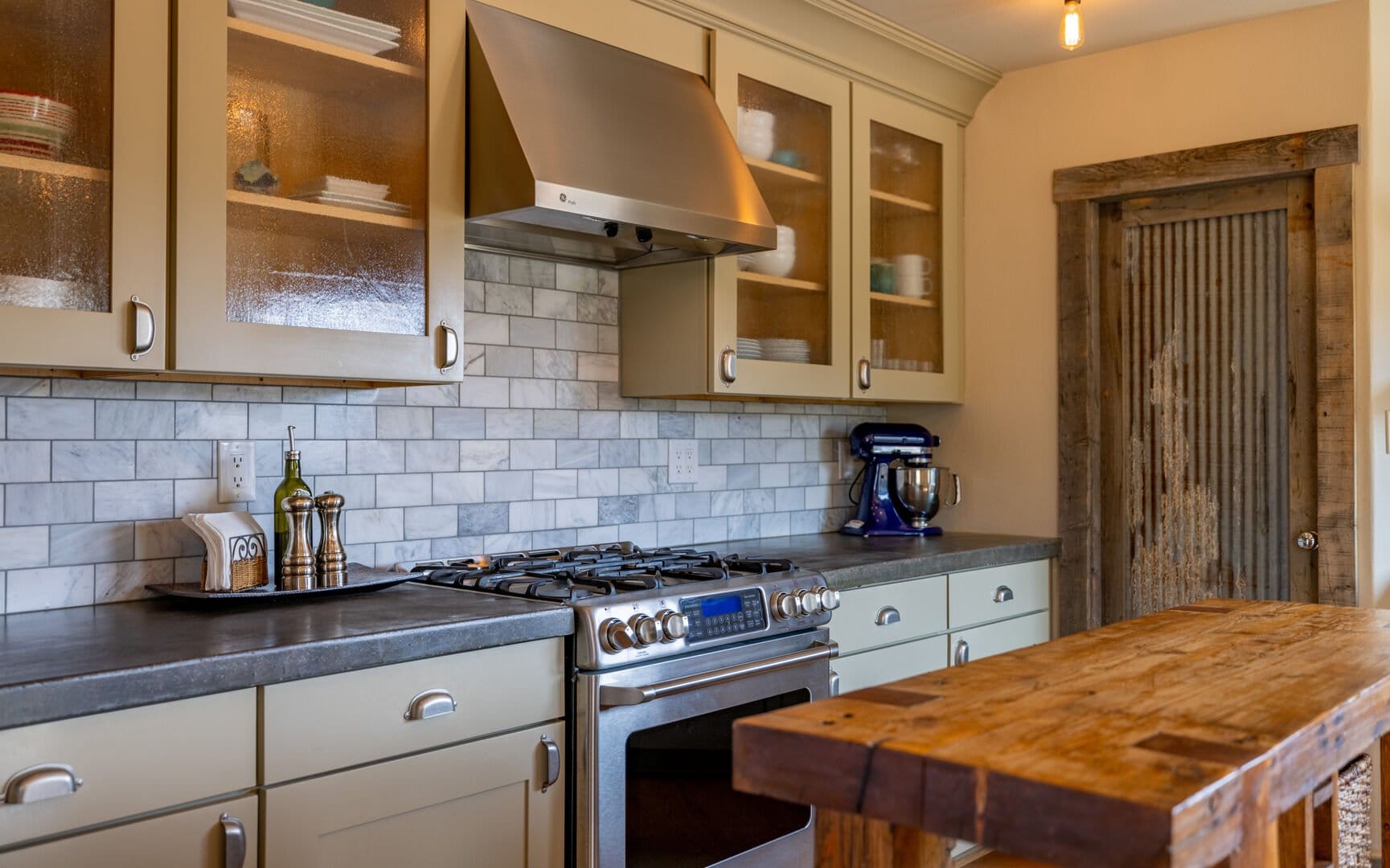 Rustic kitchen with wooden island.