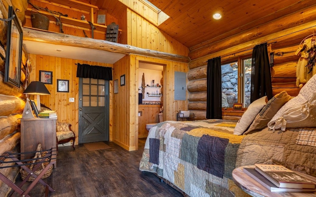 Cozy log cabin bedroom interior.