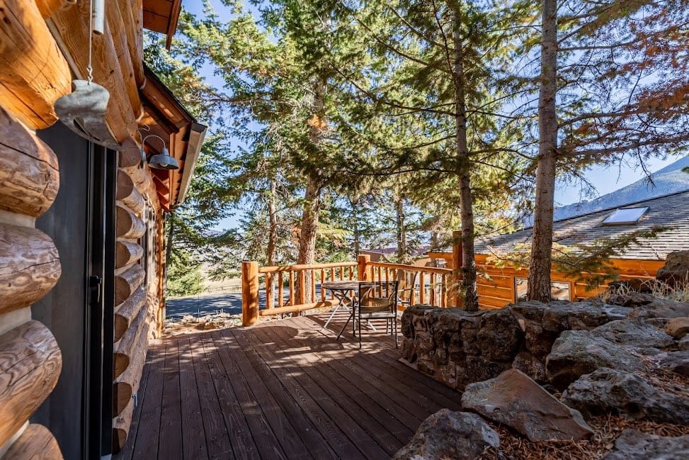 Wooden deck with forest view.