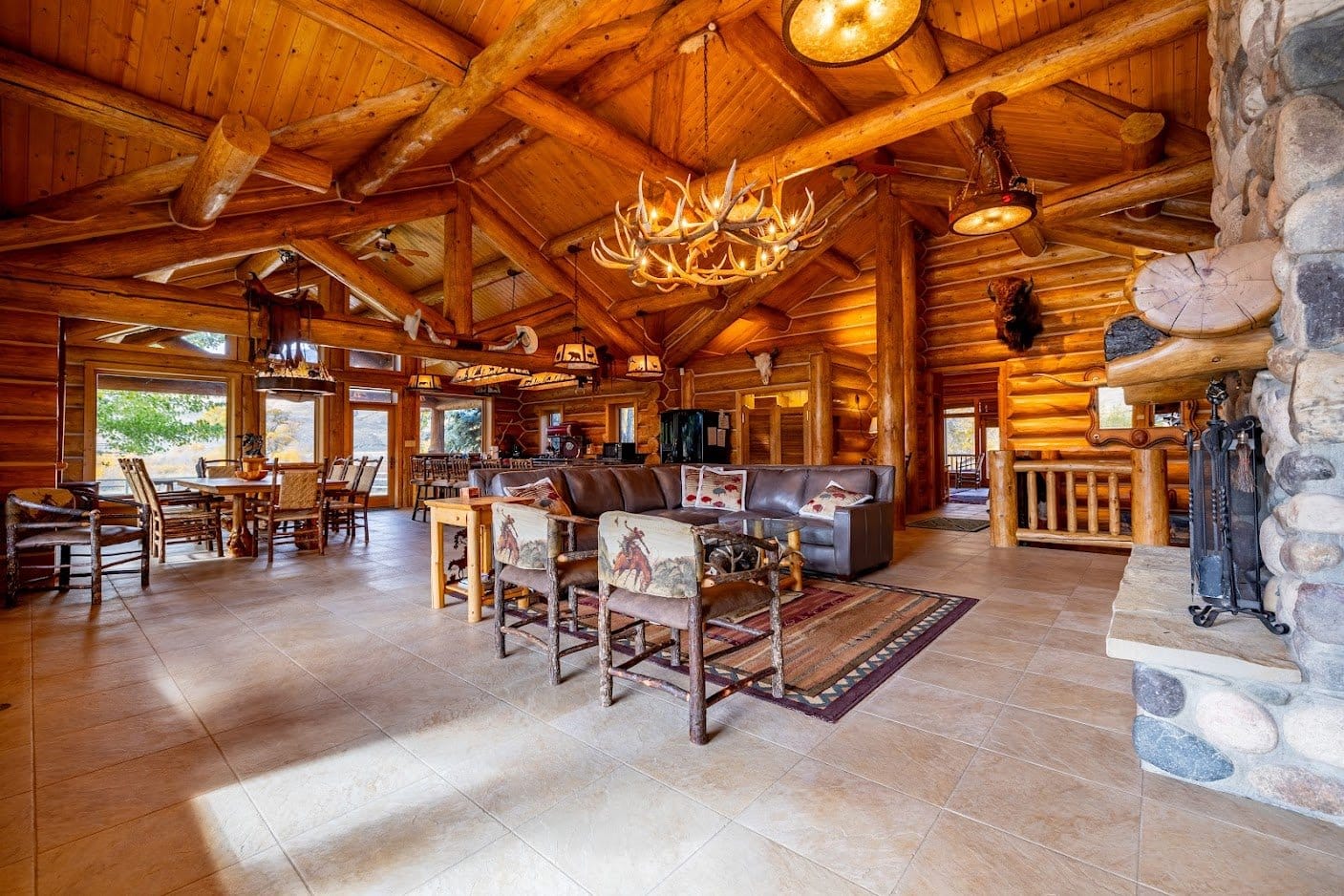 Rustic log cabin interior with fireplace.