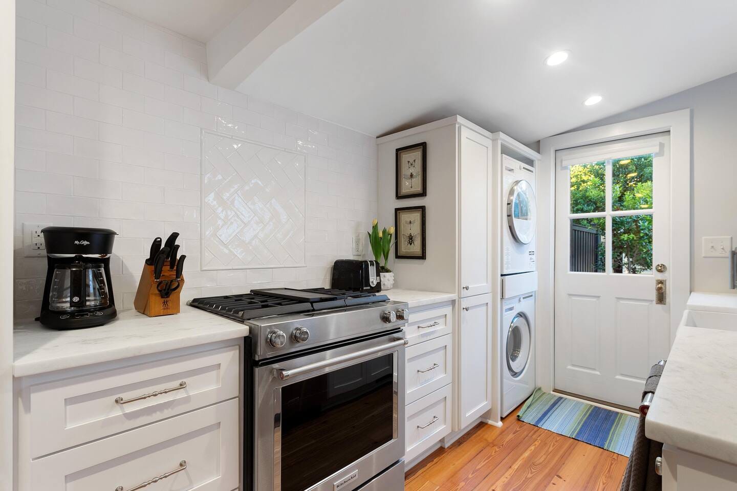 Kitchen with appliances and laundry area.