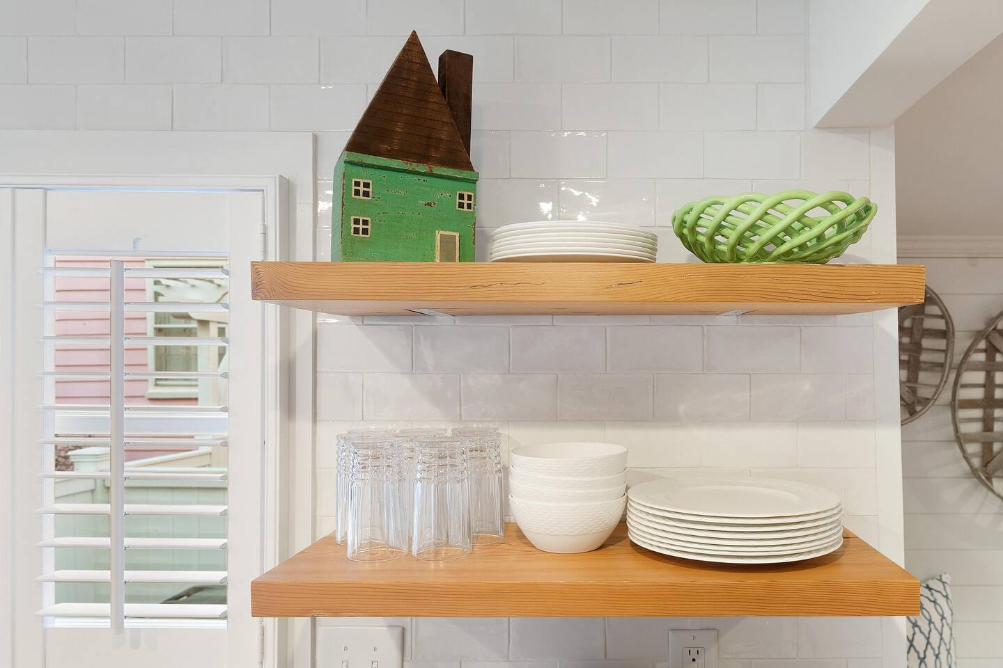 Kitchen shelves with dishes, decor.