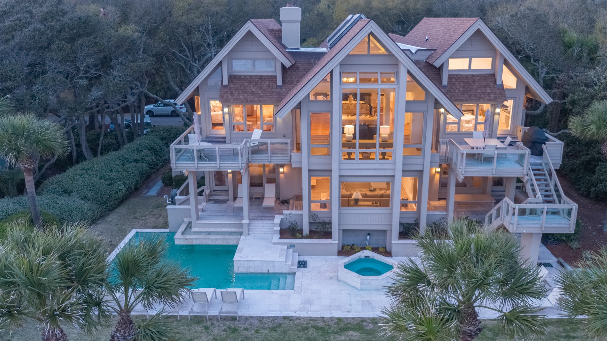 Luxurious house with pool, trees.