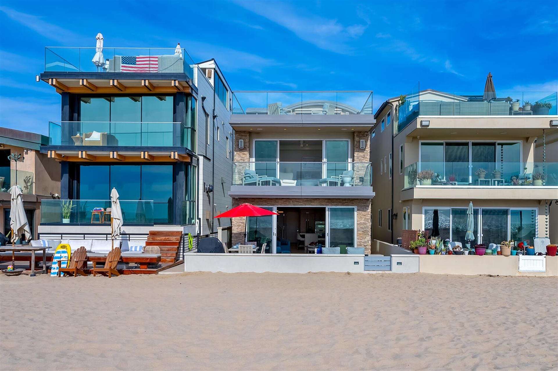 Modern beachfront homes with balconies.