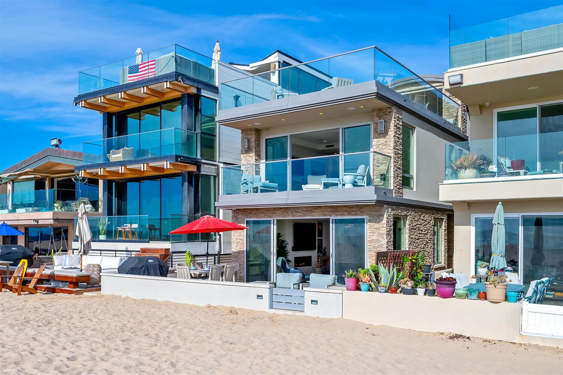 Modern beachfront house with balconies.