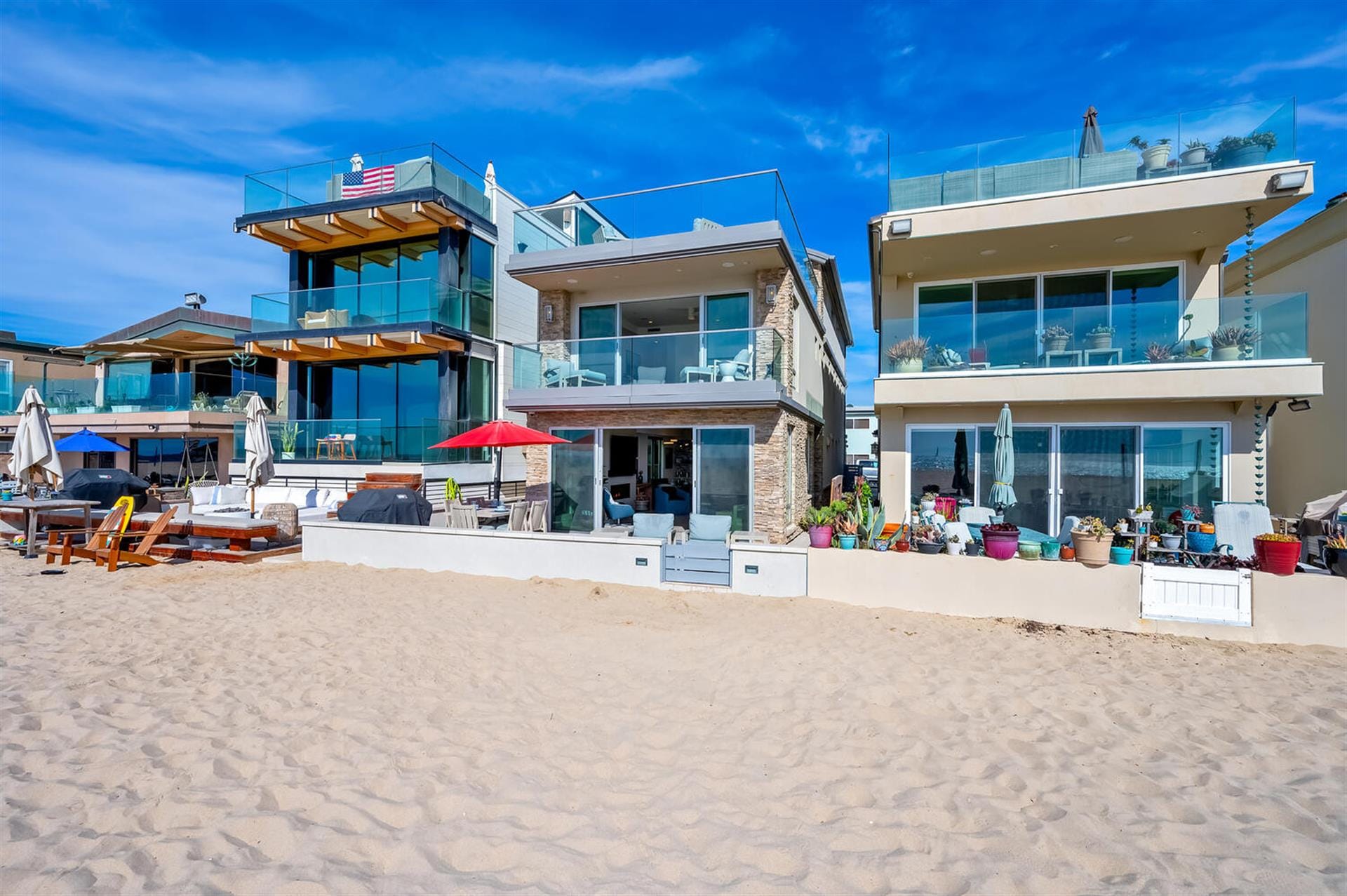 Modern beachfront houses with balconies.