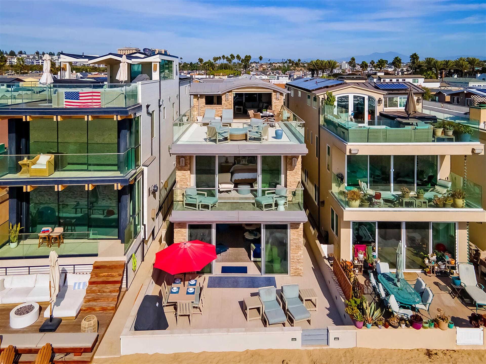 Beachfront homes with glass balconies.